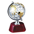 Silver and gold metal globe on rosewood base (4.25" x 7.5")